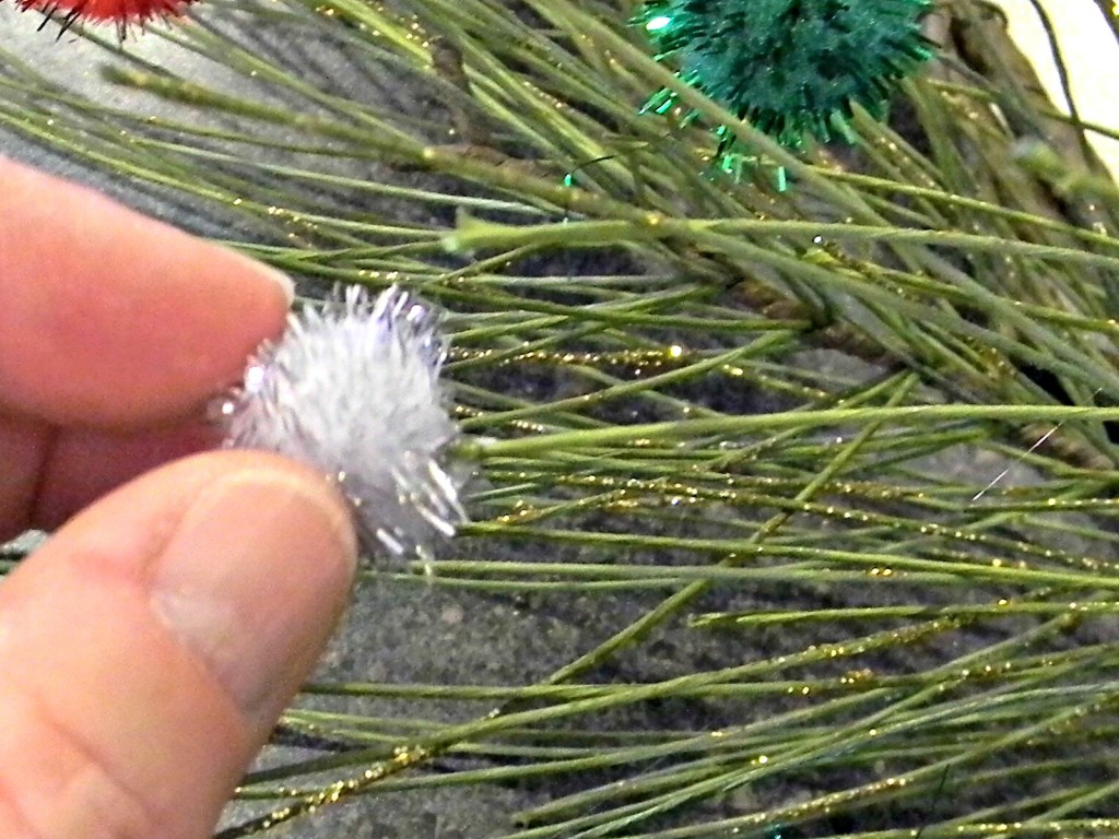 pine-and-pom-pom-wreath-applying-pom-poms