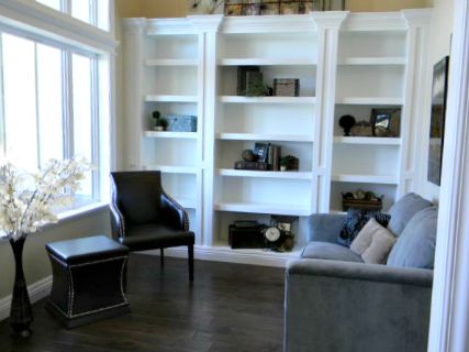 den wall of bookcases