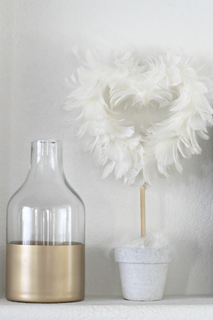 Gold bottle and feather heart topiary