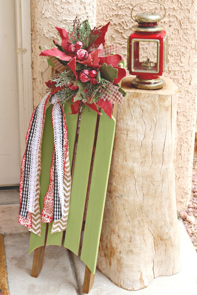 decorated-sled-by-tree-stump