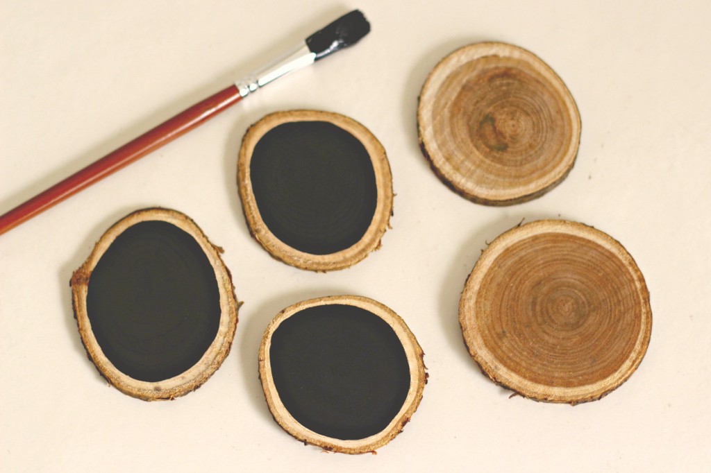 wood-slice-ornament-being-painted