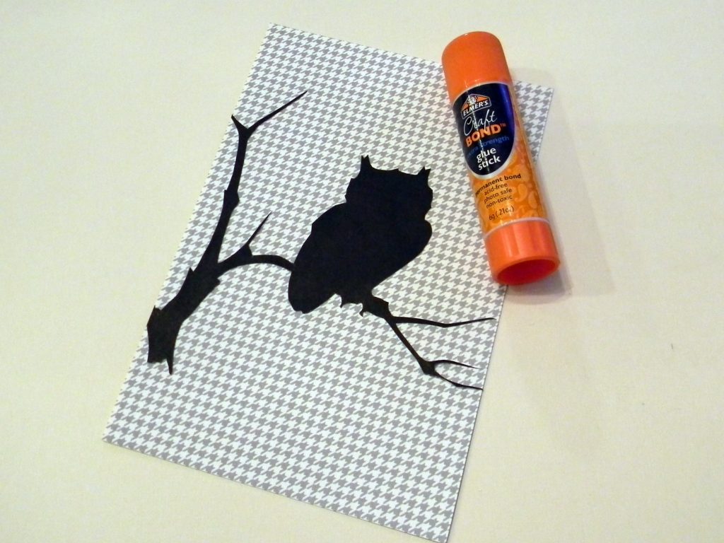 Attach Halloween Silhouettes to patterned paper