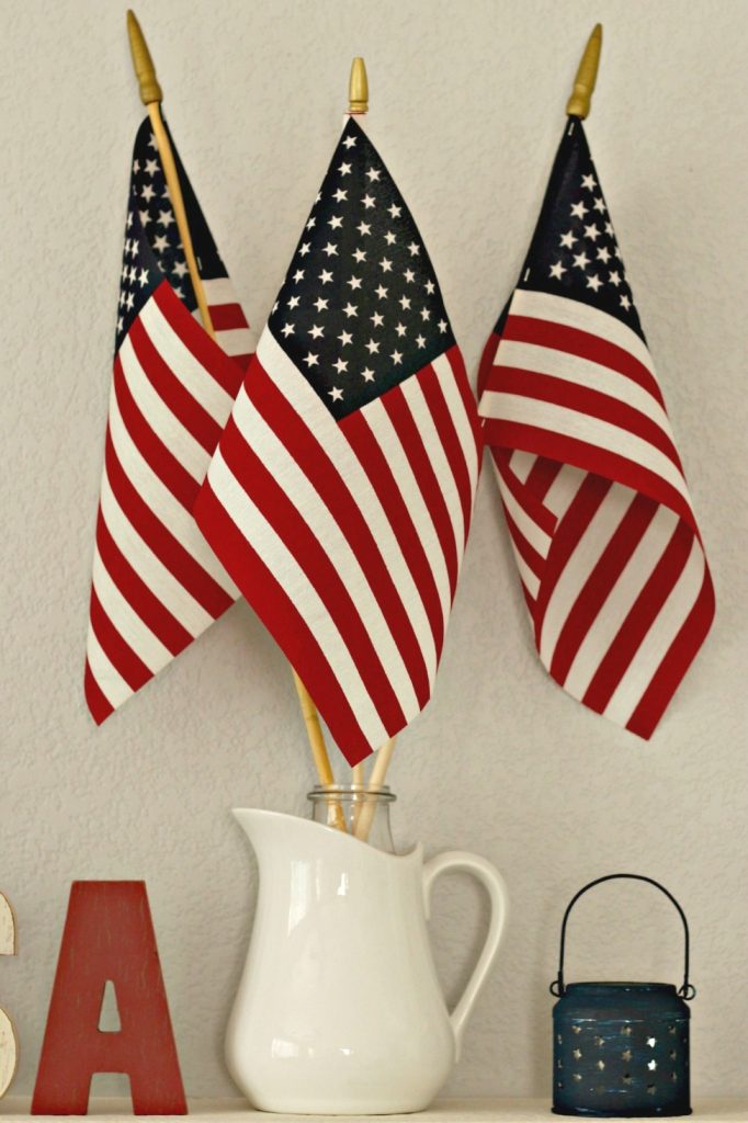Red White and Blue Mantel flags in pitcher