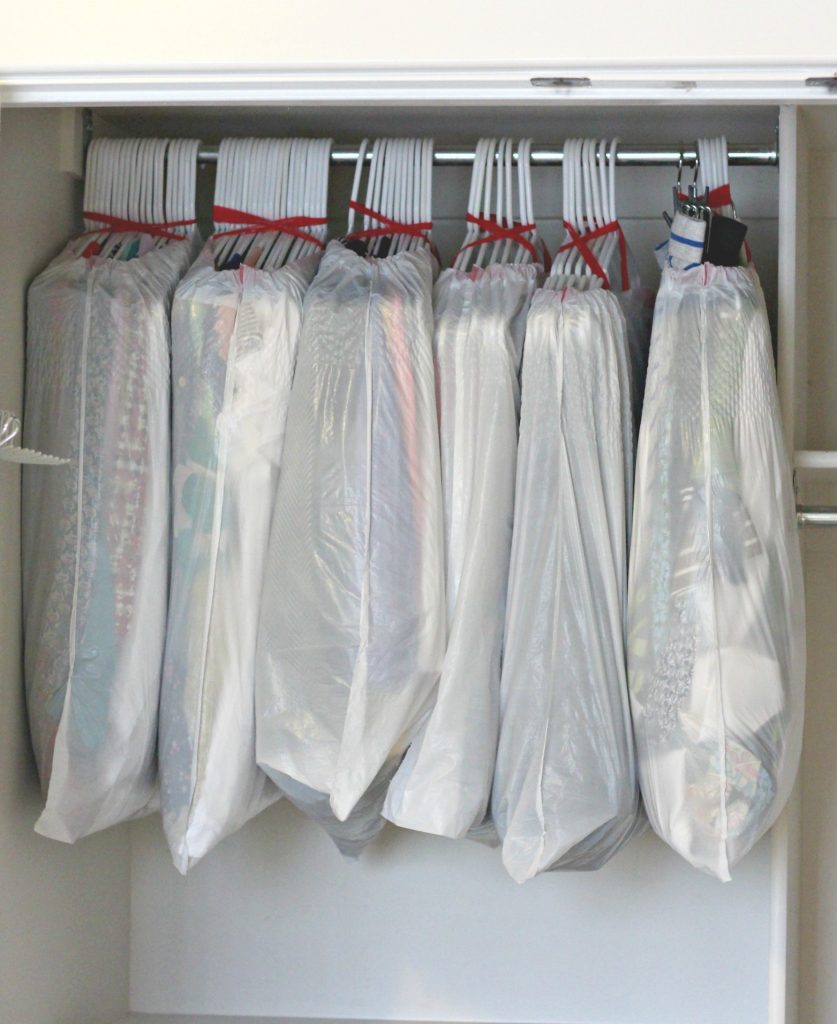 An easy way to move the clothes in your closet: wrap a trash bag