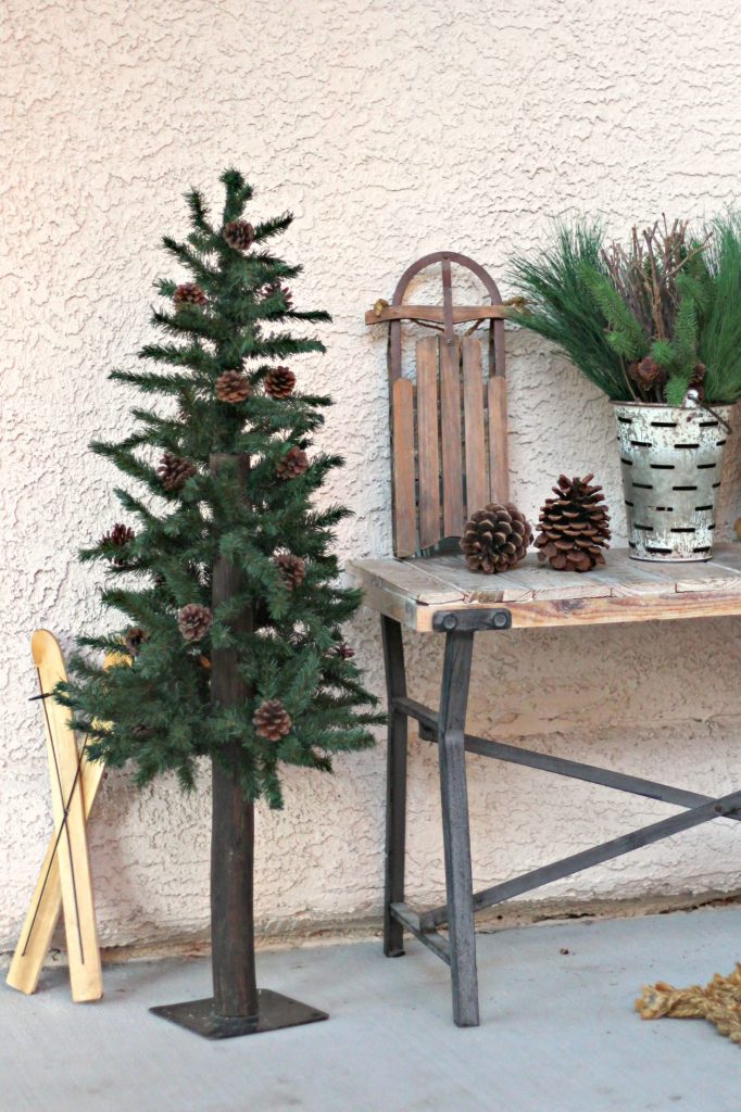 front porch sled and pine tree