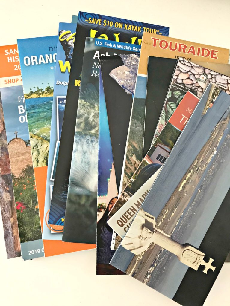 June decluttering travel brochures